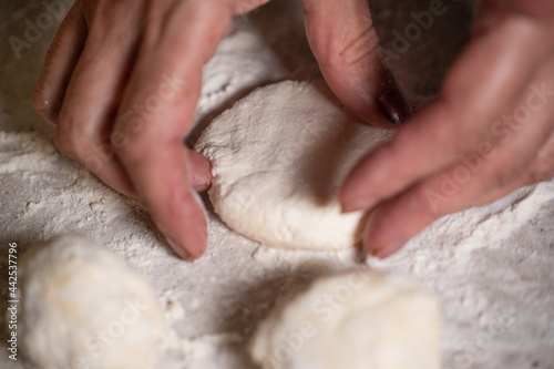 Hands and dough for baking