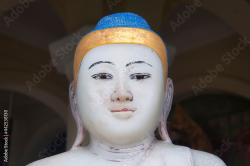 weathered white buddha kek lok si temple