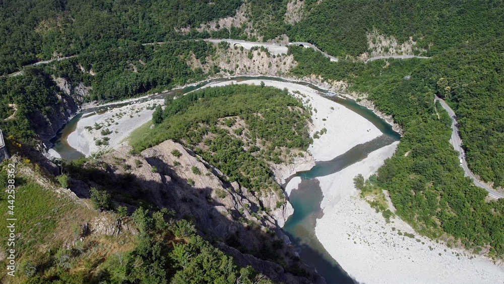 Europe, Italy, Val Trebbia, Brugnello is an ancient historical village above the mountain overlooking the incredible river that reaches Bobbio - drone view of San Salvatore , the bends of the river Europe, Italy, Val Trebbia, Brugnello is an ancient historical village above the mountain overlooking the incredible river that reaches Bobbio - drone view of San Salvatore , the bends of the river