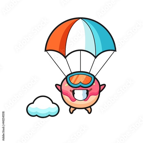 doughnut mascot cartoon is skydiving with happy gesture