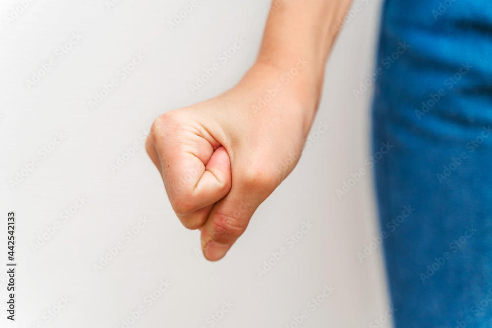 Obraz premium A child's angry fist near the leg
