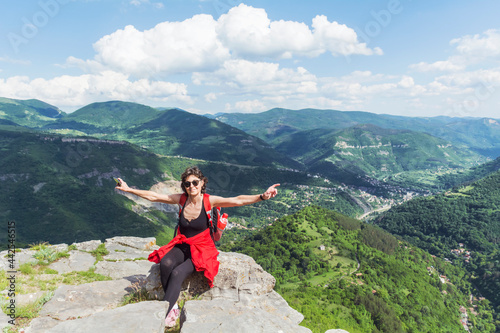 Tourist Woman with Backpack on the Top of Summer Mountain with Stunning View. Summer Mountain in Bulgaria ,Bov Village ,Balkan Mountain ,Iskar Gorge