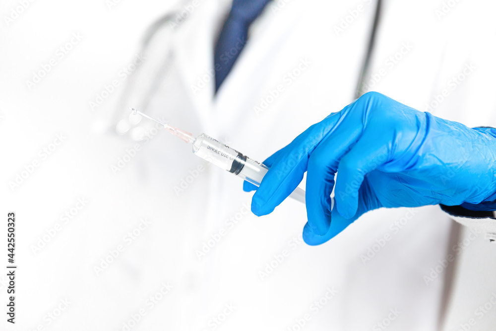Medicine doctor holding the syringe Medicine doctor holding the syringe