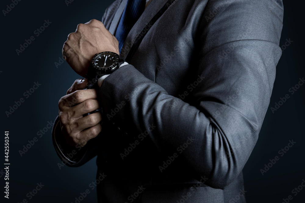 Fototapeta premium Businessman checking time on watch