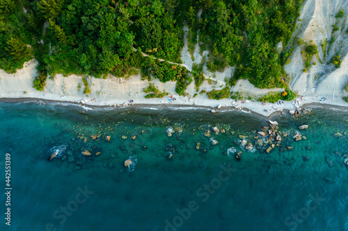 Fototapeta Naklejka Na Ścianę i Meble -  Aerial view about the moon bay slovenia. Unique beach in adriatic sea near by Piran city. Beautiful untouchable nature. It has only one way down to the beach.