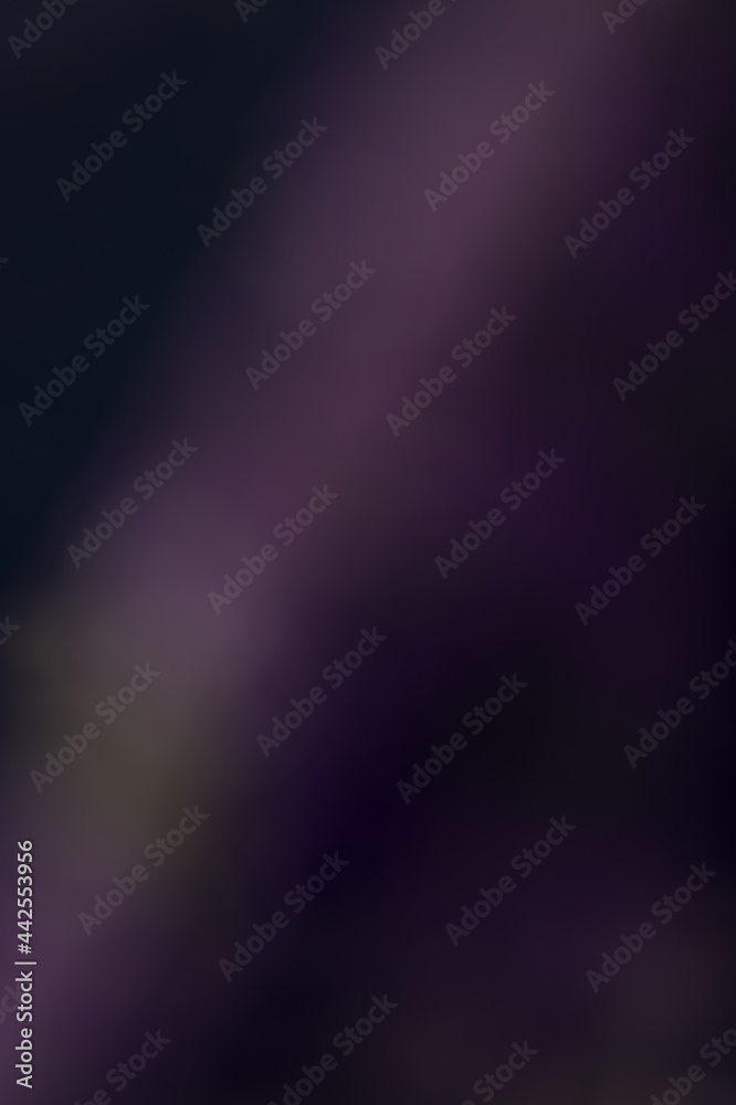 Blurry and out of focus dark purple background with copy space for text