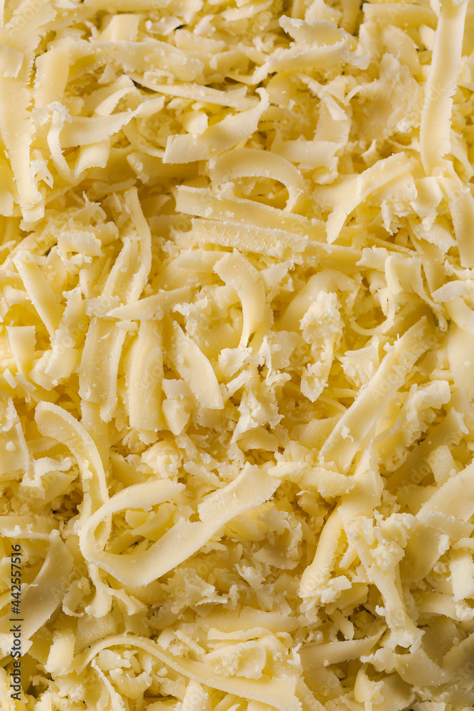 grated mozzarella cheese texture for background. Stock Photo Adobe Stock