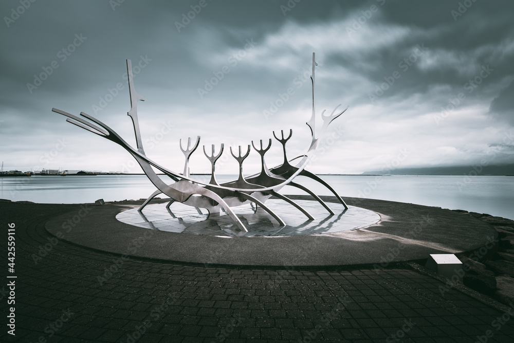 Perspective view of the Sun Voyager Sculpture against dramatic sky, Reykjavìk, Iceland - obrazy, fototapety, plakaty 