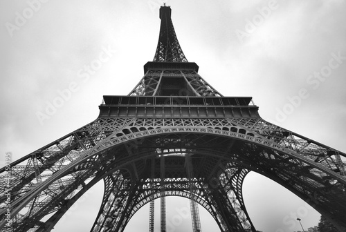 Front View of Eiffel Tower with Cloudy Sky as Monochrome