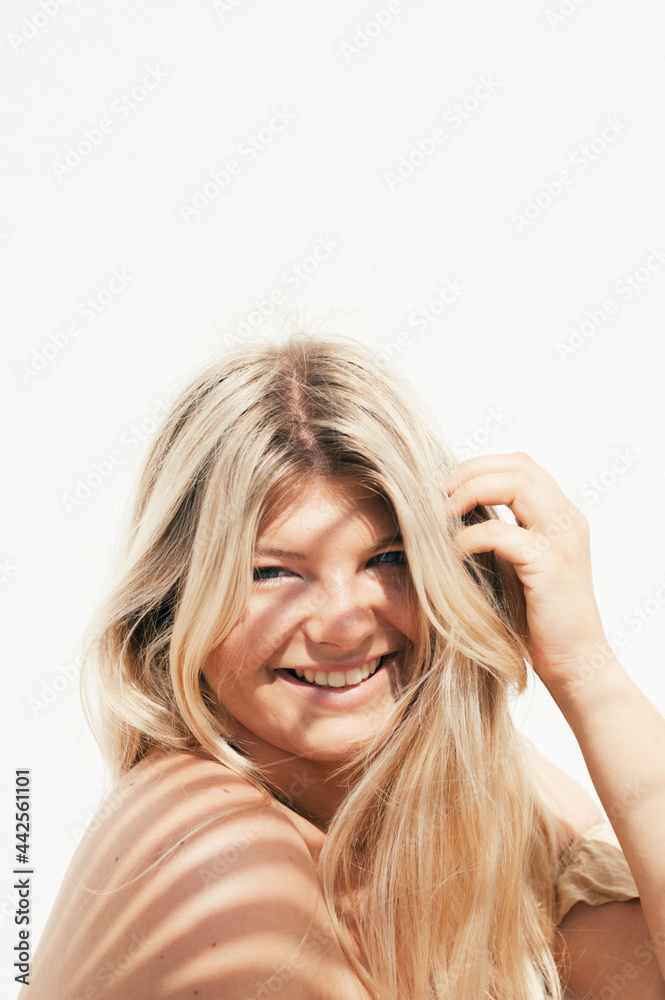 attractive plus size young woman outdoors portrait with tropical shadows attractive plus size young woman outdoors portrait with tropical shadows