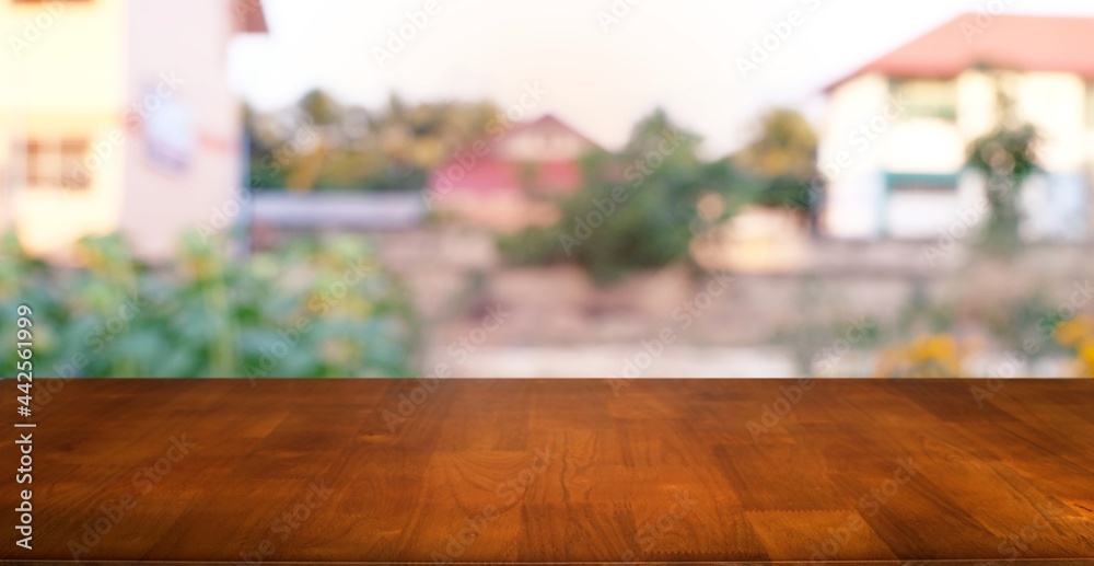 Empty wooden table in front of abstract blurred background of coffee shop . can be used for display or montage your products.Mock up for display
