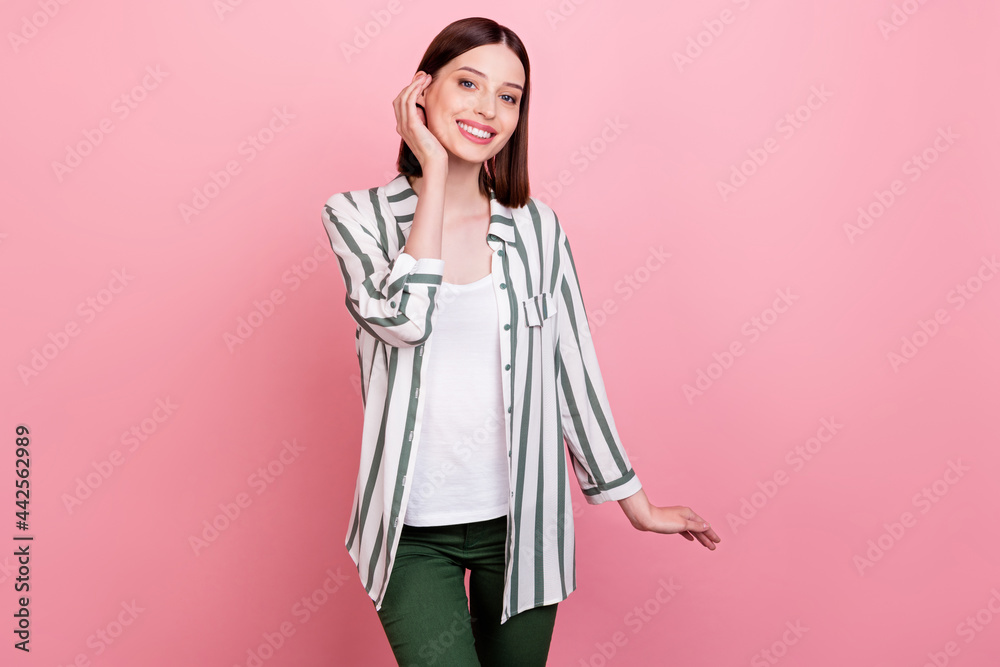 Photo of sweet brunette young lady hand face wear white shirt isolated on pink color background Photo of sweet brunette young lady hand face wear white shirt isolated on pink color background