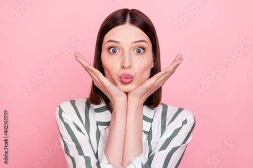 Photo of young attractive pretty girl plump lips hands touch chin isolated over pink color background