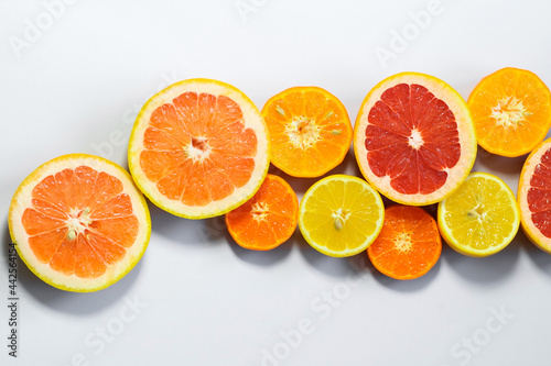 Sliced citrus on a white background. Grapefruit  lemon  tangerine.