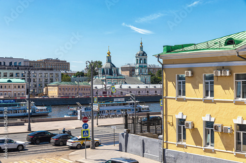 View of the Moskva River, motor traffic on the embankment and the domes of St. Nicholas Church