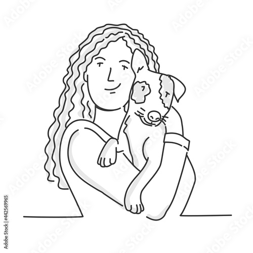 Woman with long hair embracing dog.