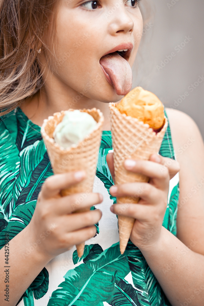 Cute kid girl eating ice cream cone Stock Photo Adobe Stock