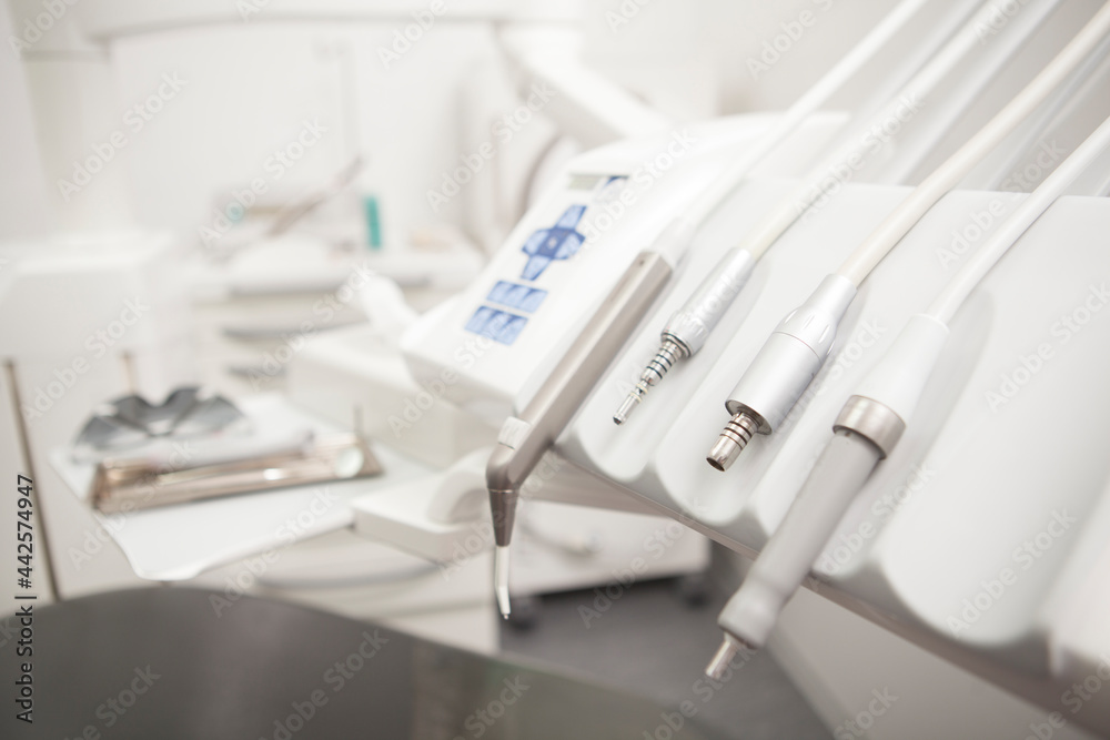 Close up of dental instruments on dental chair at the clinic, copy space