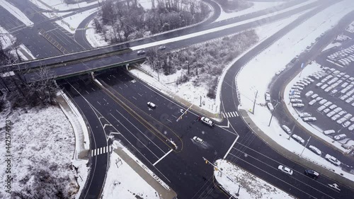 Aerial top view road highway during a snowstorm