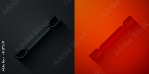 Paper cut Cuticle pusher icon isolated on black and red background. Tool for manicure. Paper art style. Vector