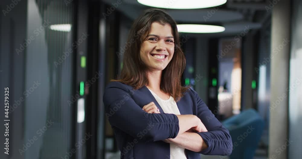 Portrait of smiling caucasian businesswoman with brown hair in modern office Portrait of smiling caucasian businesswoman with brown hair in modern office