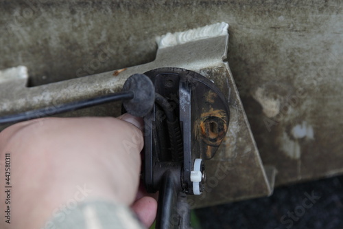 Marine sonar ultrasonic transducer sensor mounting on boat transom photo