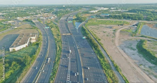 Aerial view of vehicles driving on Alfred E. Driscoll Bridge a huge complex road junction at the entrance connected for Sayreville town New Jersey photo