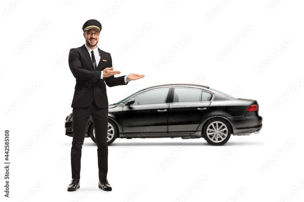 Full length portrait of a professional chauffeur pointing at a black car Full length portrait of a professional chauffeur pointing at a black car