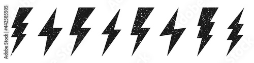 Lightning bolt icons with grunge texture isolated on white background. Vintage flash symbol, thunderbolt. Simple lightning strike sign. Vector illustration.