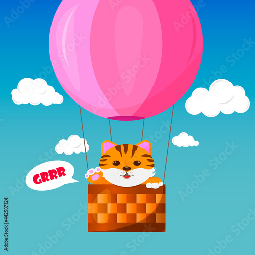Tige on a pink hot air balloon in a blue sky with white cloude
