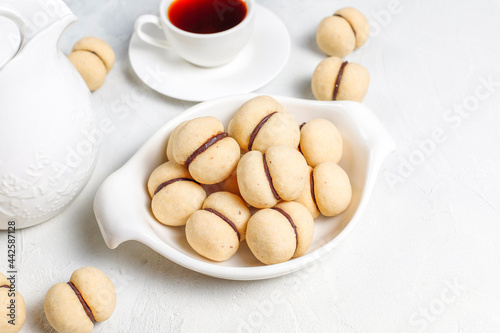 фотографія Baci di dama homemade Italian hazelnut biscuits cookies with chocolate