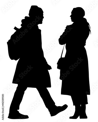Young man and woman walking at street. Isolated silhouette on a white background