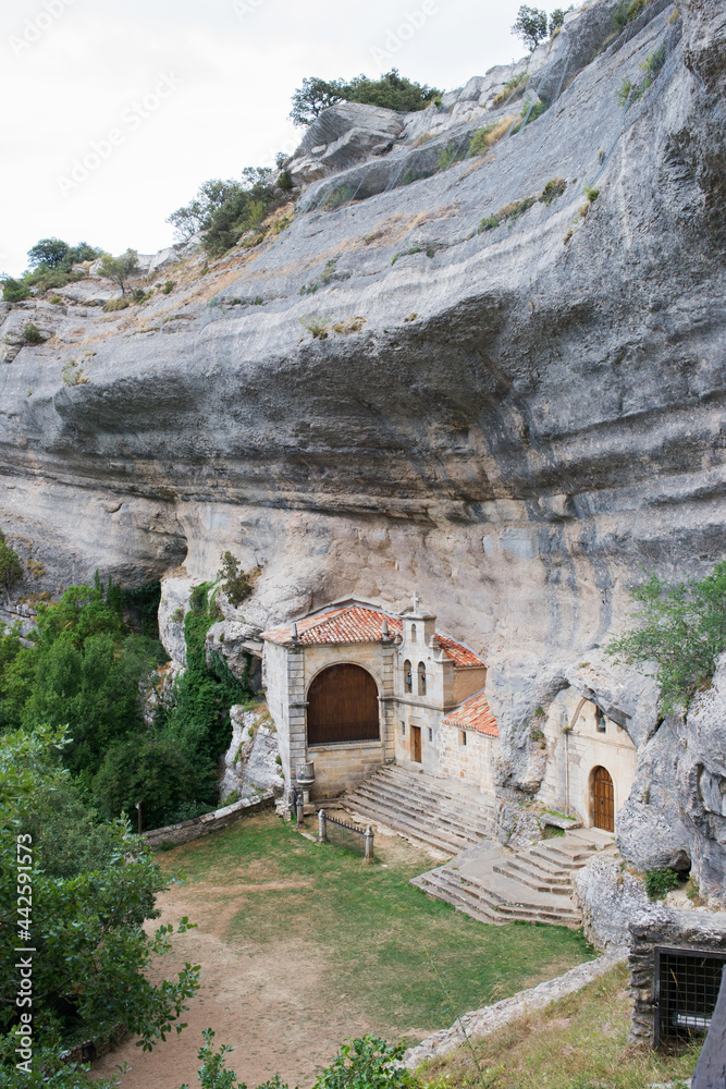 Entrance to National Monument Ojo Guarena, caves and church in the rock. Merindades, Burgos, Spain, Europe