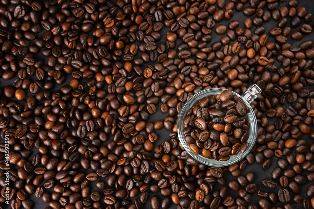 Fototapeta premium coffee beans close up. Top view. Texture of roasted brown coffee beans.Top view with copy space.