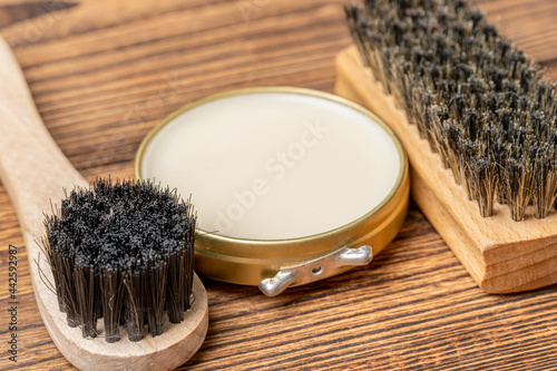 Shoe wax polish cream and cleaning brushes for leather boots care
