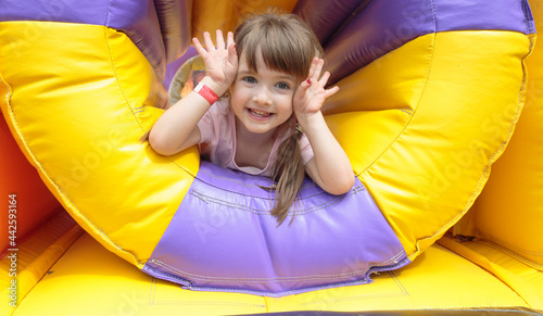 girl on an inflatable trampoline