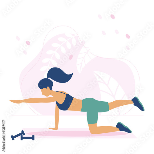 An athletic woman stands in a plank on one arm and one leg. Doing fitness on a pink yoga mat with dumbbells nearby.