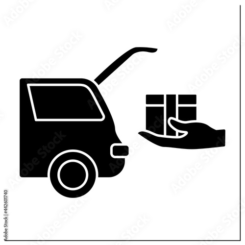 Curbside pickup glyph icon. Shipping parcel into car trunk. Store associate brings pickup order. Contact-free delivery concept.Filled flat sign. Isolated silhouette vector illustration