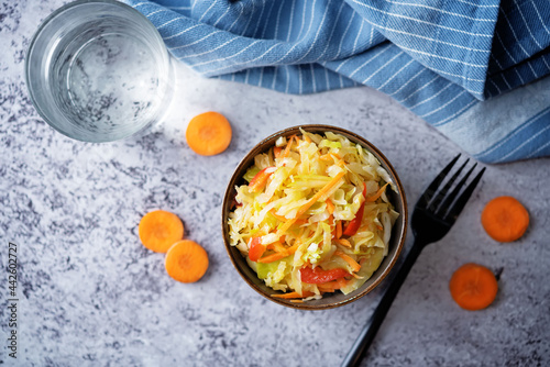Cabbage carrot red pepper salad in a bowl
