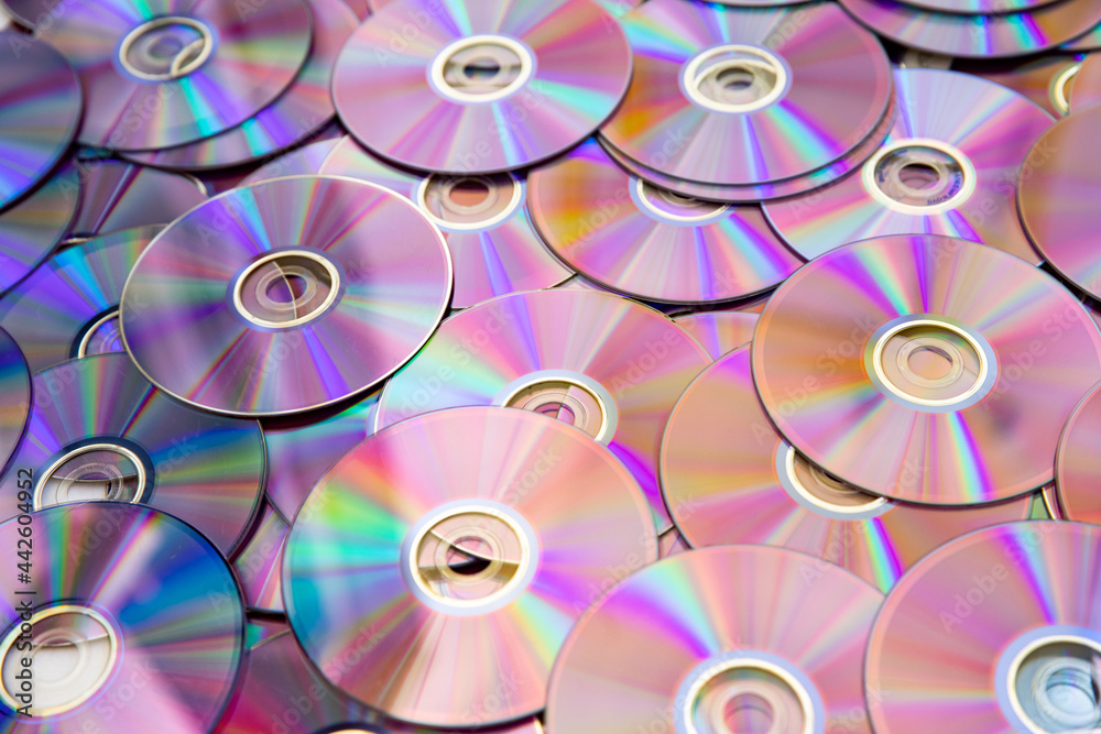 Discs for music and movie data are iridescent with mother-of-pearl. Discs for music and movie data are iridescent with mother-of-pearl.