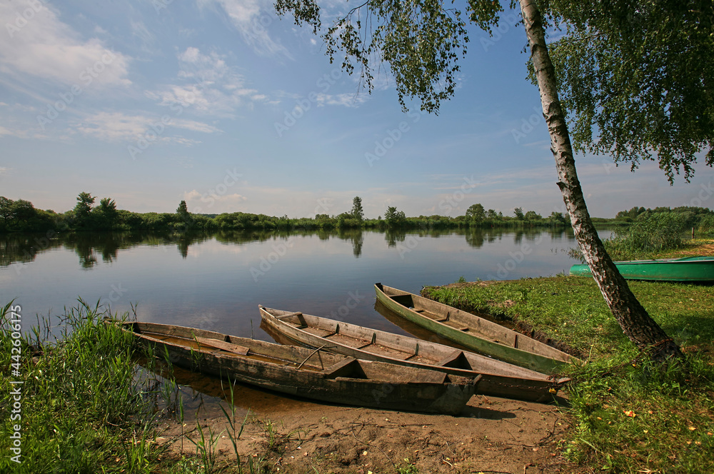 Eastern Europe, Republic of Belarus, Kachanovichi village, Pinsk district, Brest region. River and boats. Eastern Europe, Republic of Belarus, Kachanovichi village, Pinsk district, Brest region. River and boats.