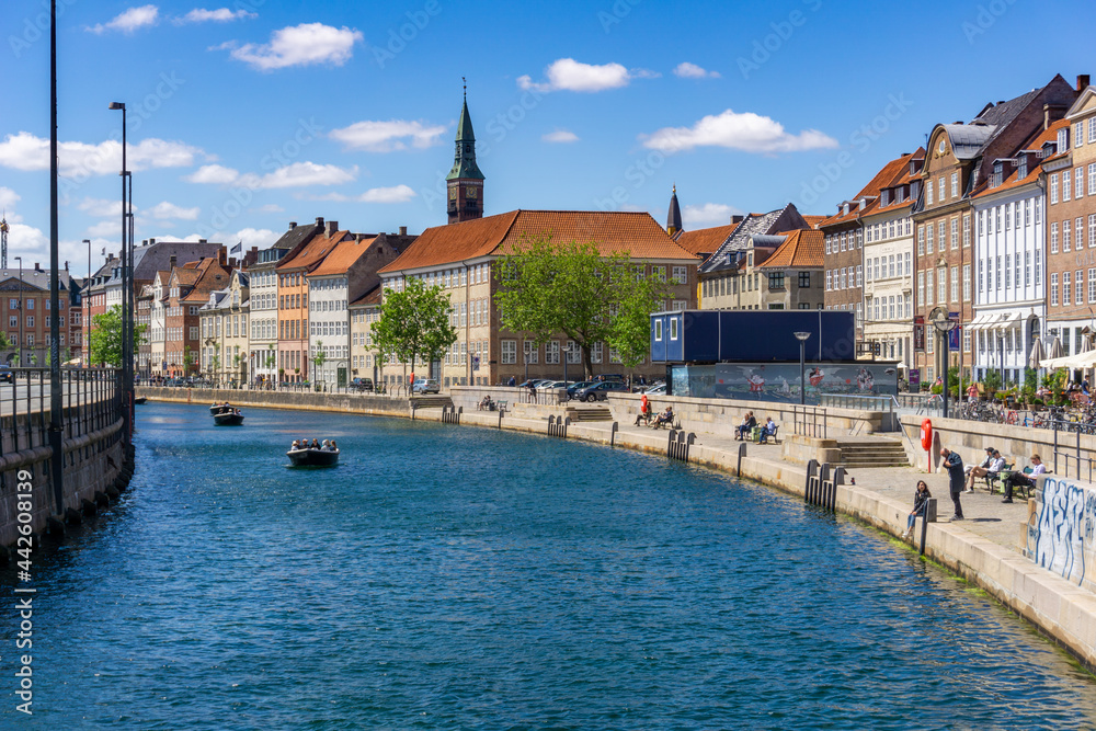 Fototapeta premium people enjoy a recreational boat cruise on the canals of Copenhagen on a beautiful summer day
