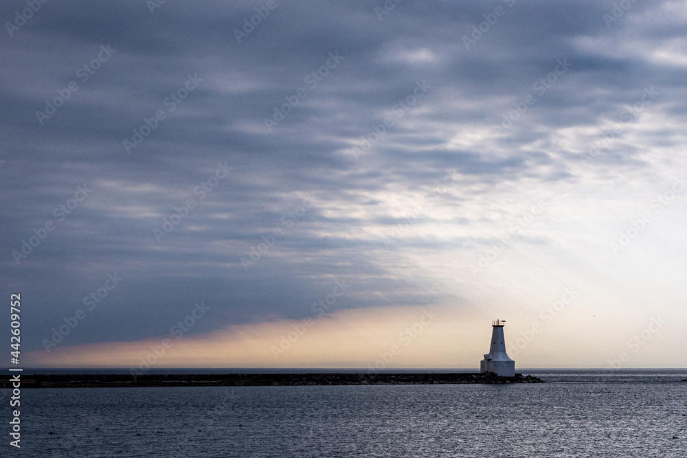 Fototapeta premium Storn clouds approaching a lighthouse