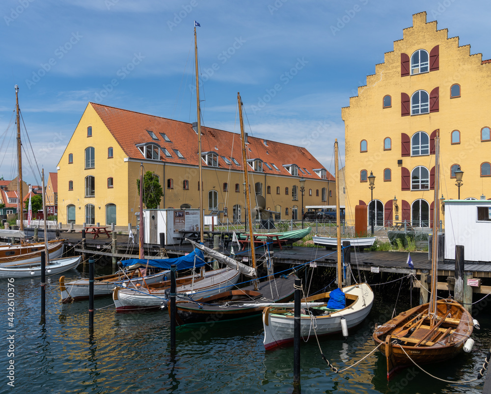 the old harbor front in Svendborg with historic wooden boats in the open-air maritime museum on the waterfront