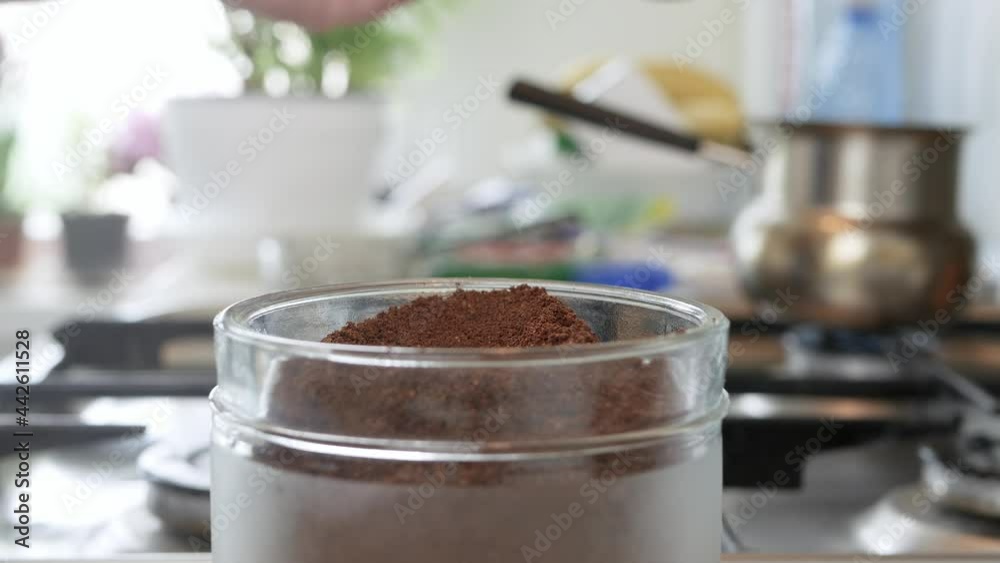 Shooting with a Person Taking a teaspoon of Freshly Ground Coffee from a Jar. Preparing a Fresh Coffee in the Morning. Shooting with a Person Taking a teaspoon of Freshly Ground Coffee from a Jar. Preparing a Fresh Coffee in the Morning.