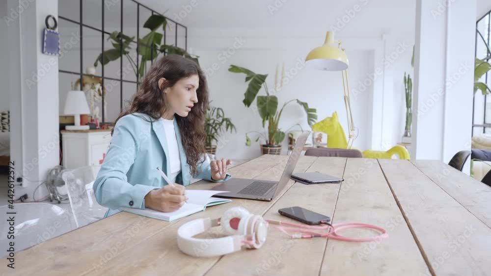 Businesswoman works at home. Office worker typing on laptop, working remotely. Businesswoman works at home. Office worker typing on laptop, working remotely.