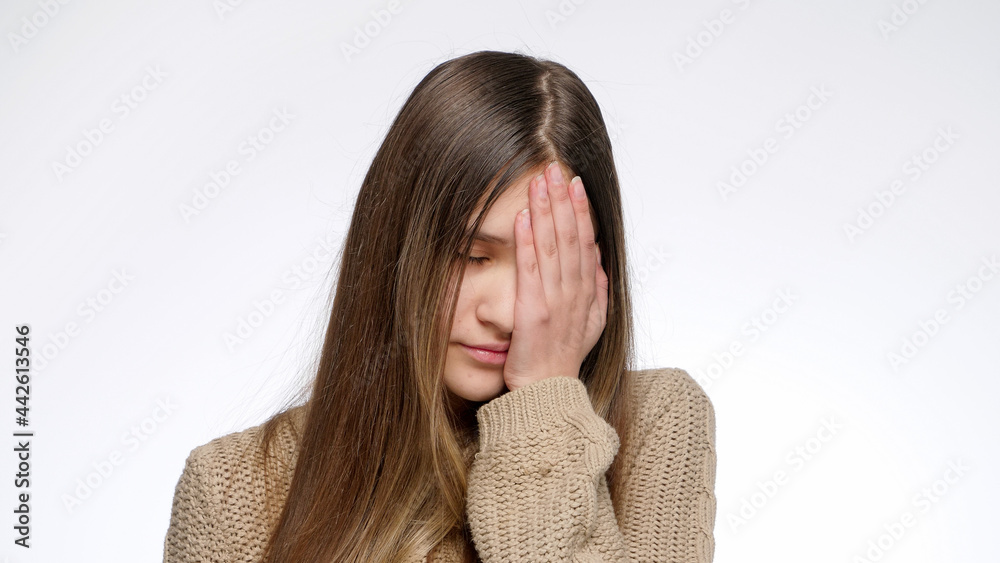 Portrait of displeased girl making facepalm gesture and hitting face with hand Portrait of displeased girl making facepalm gesture and hitting face with hand