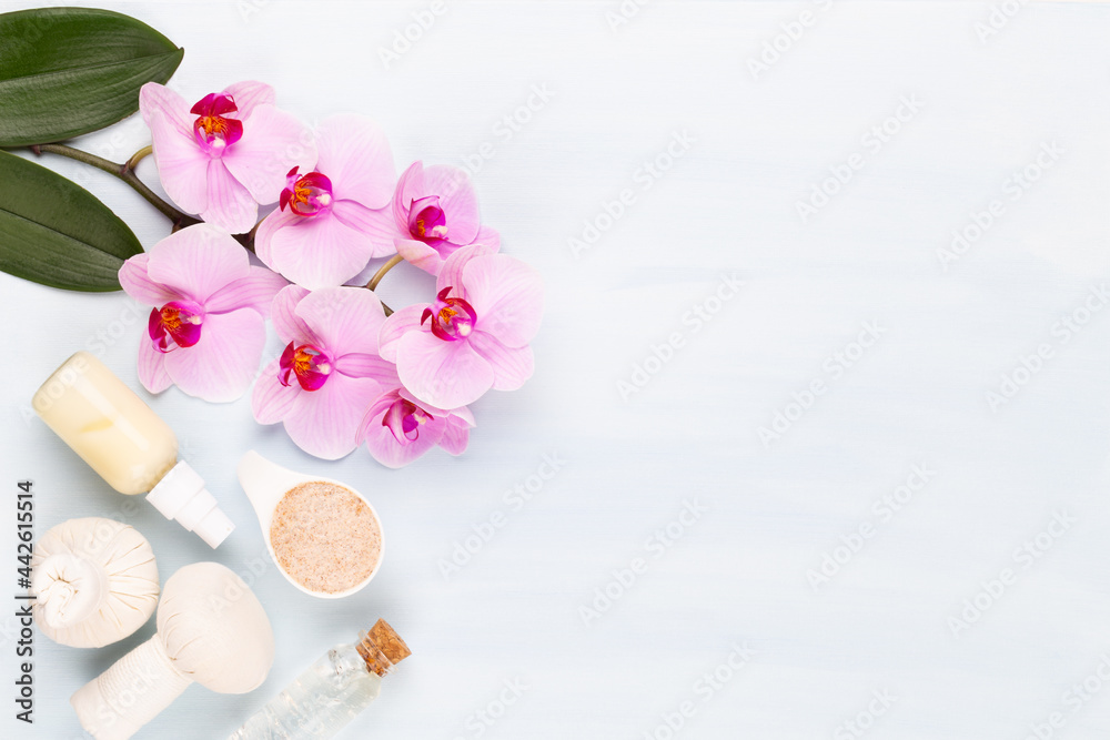 Sea salt, aromatherapy oil in bottles and orchid on vintage wooden background. Sea salt, aromatherapy oil in bottles and orchid on vintage wooden background.