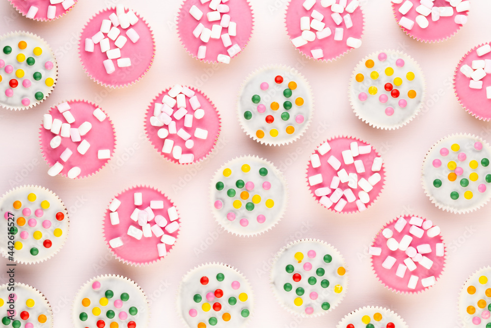 Colorful cupcakes on a white background.