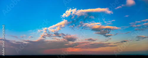Panorama of blue sky and orange clouds before sunset © PawelG Photo